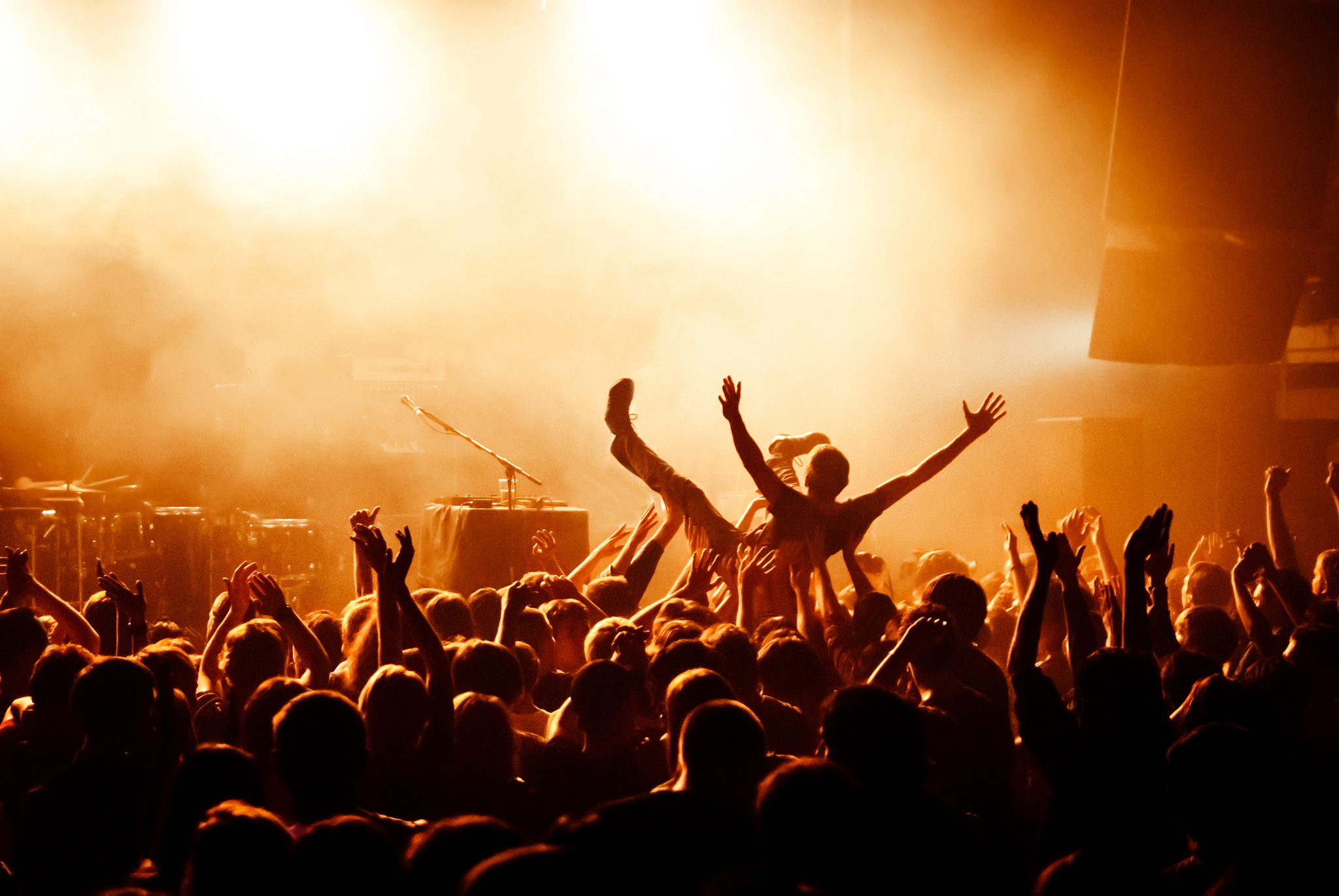 Crowd surfing during a musical performance